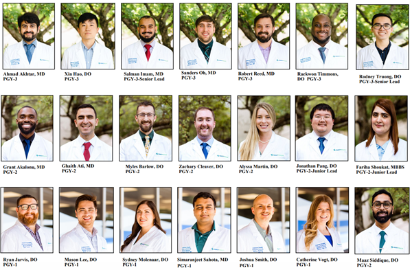 Image of 21 residents wearing lab coats laid out in a grid fashion.